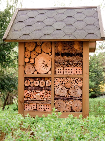 insect hotel created from natural materials in garden