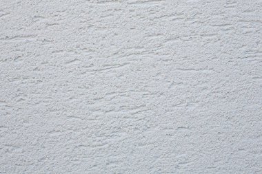 Ön cephe alçı arka planı. Tek katlı monolitik alçı dekoratif arka plan. Tek katmanlı beton alçı duvar kağıdı kazınmış. Dış yapı arka planında. Silikon Çimento Duvarı Sıvası.