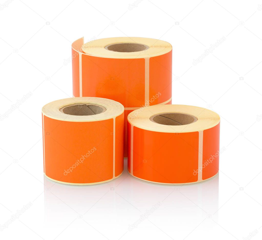 Orange label roll isolated on white background with shadow reflection. Color reel of labels for printers. Labels for direct thermal or thermal transfer printing. Orange stickers.