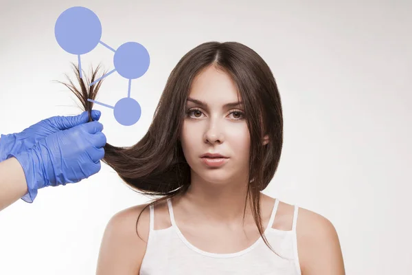 Master hairdresser procedure oil hair treatment for woman. Concept spa salon
