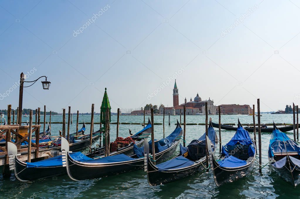 Traditional Venetian gondolas at Grand Channel at sunny day