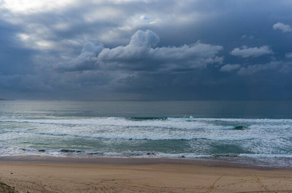 Beach view with ocean and stormy sky