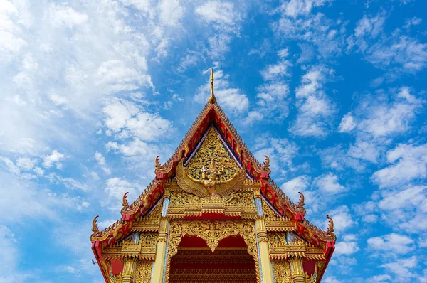 Architecture background of Buddhist temple decorated roof agains