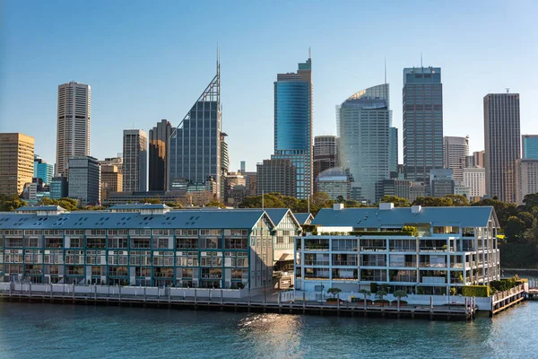 Historic Woolloomooloo wharf with Sydney CBD skyscrapers on the — Stock Photo, Image