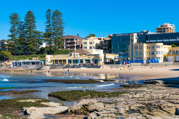 Cronulla beach coastline with people relaxing and doing sports