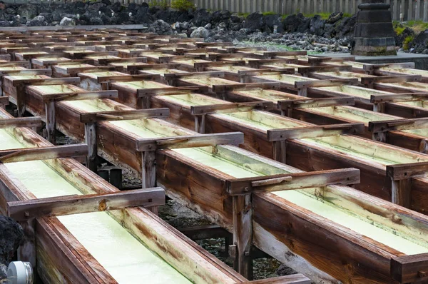 Yubatake onsen, hot spring wooden boxes with mineral water — Stock Photo, Image