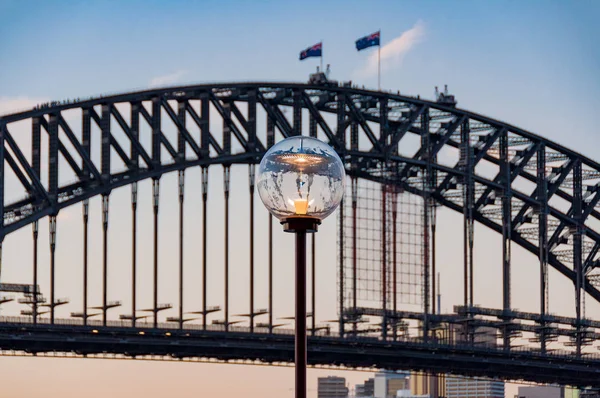 Street gas lighting against Sydney Harbour Bridge on the backgro