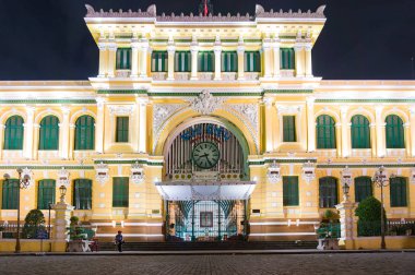 Saigon Central Post Office building at night clipart