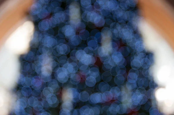 Bokeh Weihnachten traa Hintergrund mit Blaulicht und Glitzern — Stockfoto