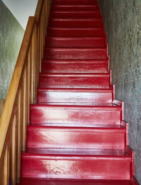 Wooden red staircase. A Guesthouse in Georgia. Tbilisi. Summer clipart