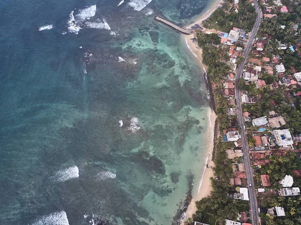 air view of the ocean and beach. City of mirissa, Sri Lanka. Shooting from the air.