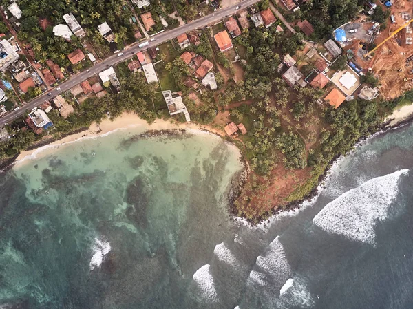 air view of the ocean and beach. City of mirissa, Sri Lanka. Shooting from the air.