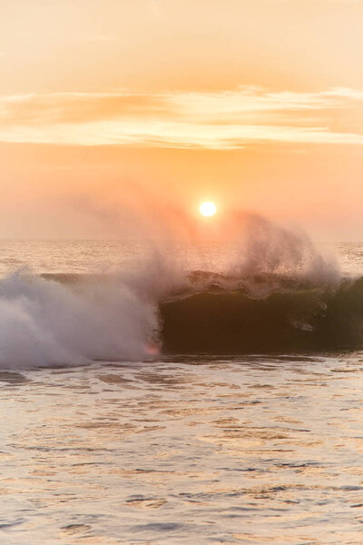 Narigama Beach. Stunning sunset on the beach overlooking the ocean and the waves.  