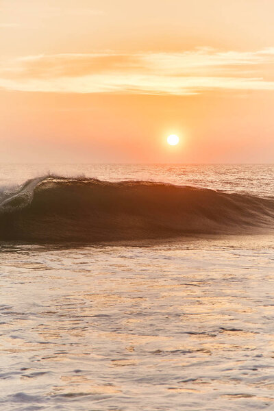 Narigama Beach. Stunning sunset on the beach overlooking the ocean and the waves.  