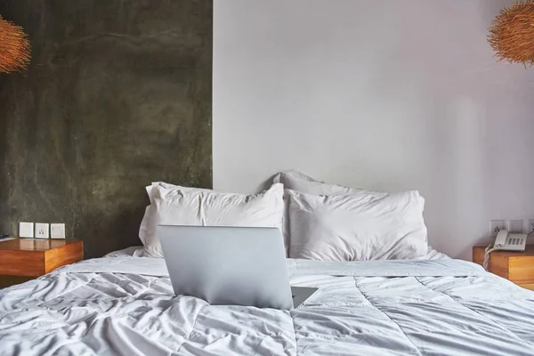 Laptop on white bed work at home concept — Stock Photo, Image