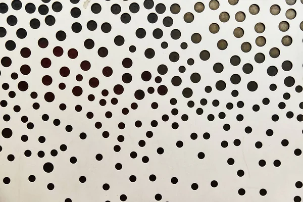 Textura de metal branco com pequenos buracos negros — Fotografia de Stock