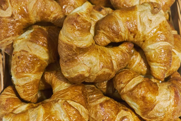 Fresh lush croissants handmade. Banquet table. Catering — Stock Photo, Image