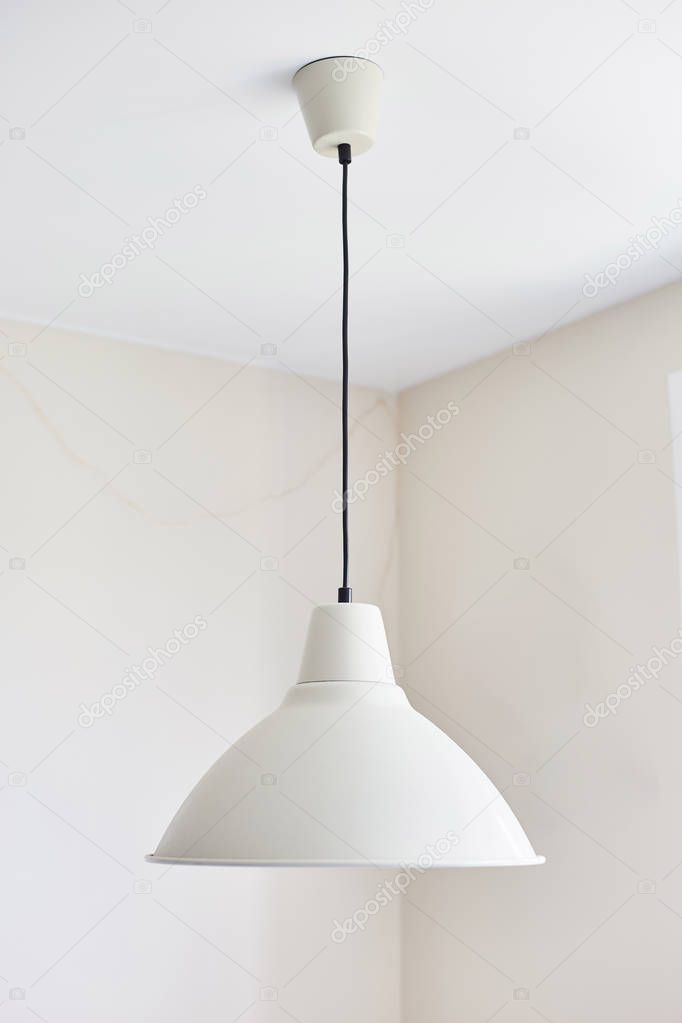 White lamp in the interior of the kitchen. 