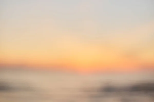 Blur sunset praia com bokeh luz onda abstrato fundo . — Fotografia de Stock