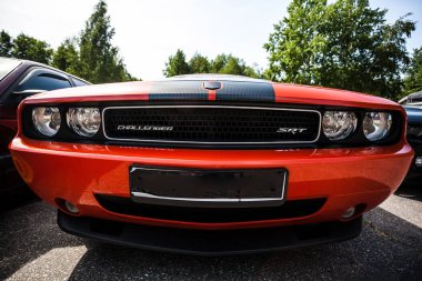St. Petersburg, Russia - June 26, 2014: Red Dodge Challenger close-up. clipart