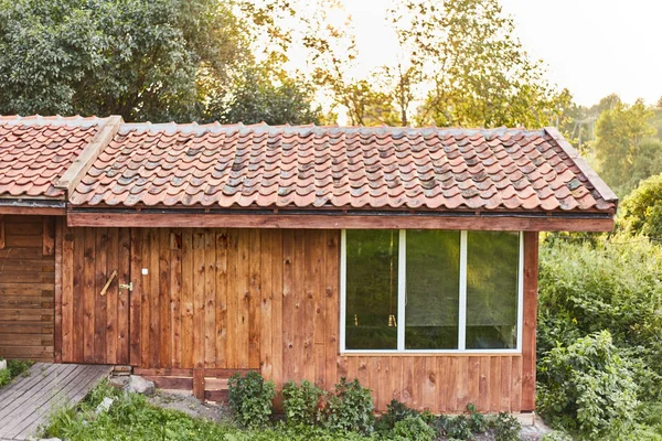 Wooden extension in the bathhouse. Tiled Roof Wooden House — Stock Image Wooden extension in the bathhouse. Tiled Roof Wooden House Stock Image