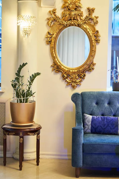 Old carved round mirror with gilding — Stock Photo, Image