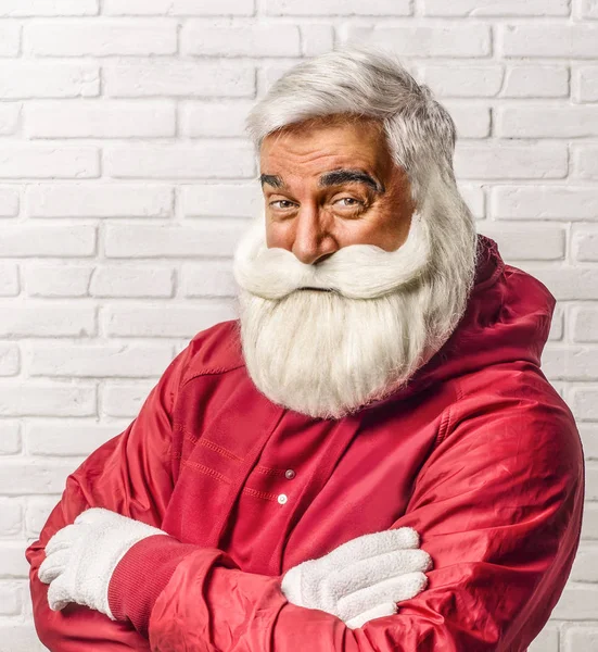 Funny Modern Santa Claus Red Jacket Looks Slyly White Brick — Stock Photo, Image