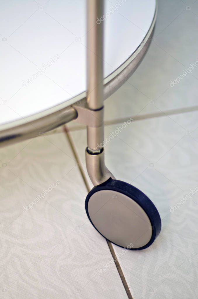 Industrial and technological objects. eautiful view and background on the wheel of a portable and small white coffee table.