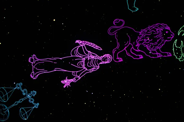 Zodiac signs art. The signs of the zodiac are colored on a black night sky in the form of an art object and installation.