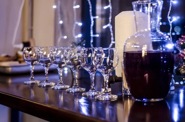 Beautiful dishes in the interior. Beautiful table setting with empty and full glasses of wine on a dark or light background in the interior of the cafe and restaurant.