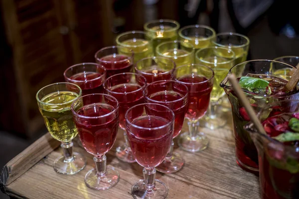 Beautiful dishes in the interior. Beautiful table setting with empty and full glasses of wine on a dark or light background in the interior of the cafe and restaurant.