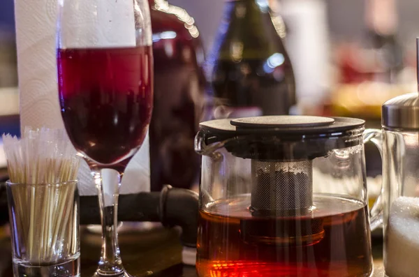 Beautiful dishes in the interior. Beautiful table setting with a kettle and tea pot in the interior of a cafe, bar and restaurant.