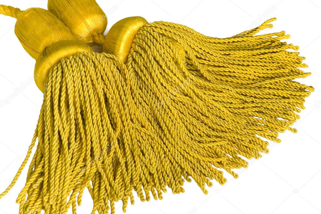 Beautiful and diverse subject. Beautiful and stylish, expensive solid edging, guard and yellow and gold rope for ceremonies, carnivals and parades on a white isolated background.