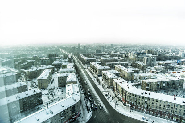 Novosibirsk, Russia - December 3, 2017. Beautiful background and view, landscape and panorama from above of the city, crossroads, streets and buildings, against the backdrop of a winter.