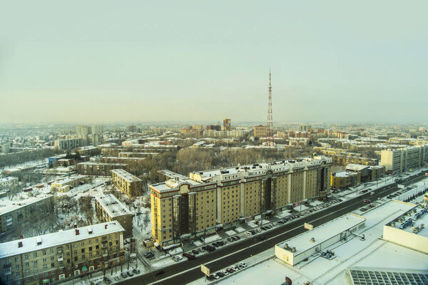 Novosibirsk, Russia - December 3, 2017. Beautiful background and view, landscape and panorama from above of the city, center and capital, streets and buildings, against the backdrop of a winter.
