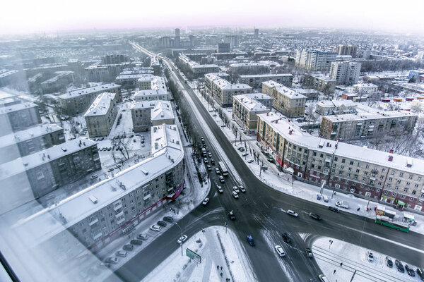 Novosibirsk, Russia - December 3, 2017. Beautiful background and view, landscape and panorama from above of the city, crossroads, streets and buildings, against the backdrop of a winter.