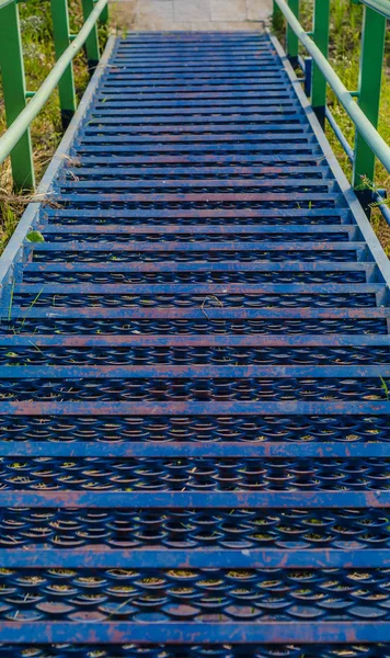 Beautiful urban objects. Beautiful background, view, landscape, panorama of the metal blue stairs in perspective during the day.