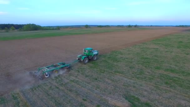 Aerial Drone Footage Green Tractor Working Field Plowing Filed Sunset — Stock Video