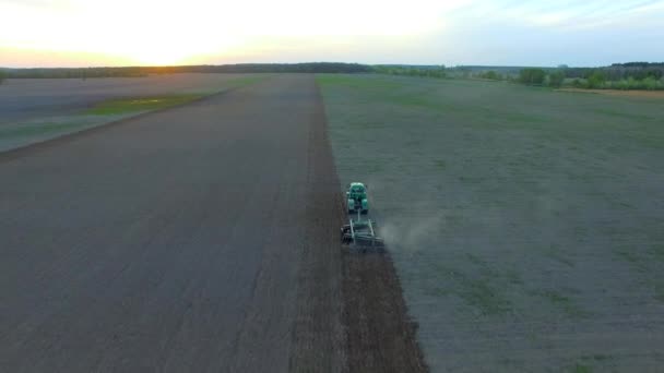 Aerial Drone Footage Green Tractor Working Field Plowing Filed Sunset — Stock Video