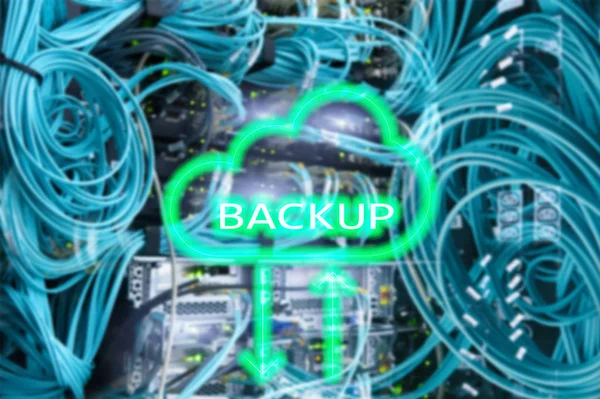 Backup button on modern server room background. Data loss prevention. System recovery. Backup button on modern server room background. Data loss prevention. System recovery.