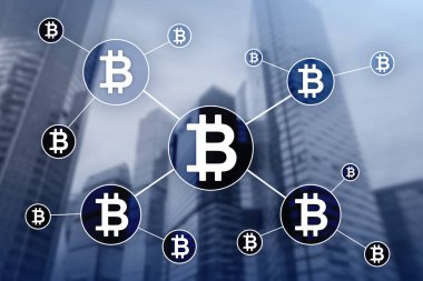 Bulanık gökdelenler arka plan üzerinde Bitcoin cryptocurrency ve blockchain teknoloji kavramı.