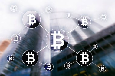 Bulanık gökdelenler arka plan üzerinde Bitcoin cryptocurrency ve blockchain teknoloji kavramı.