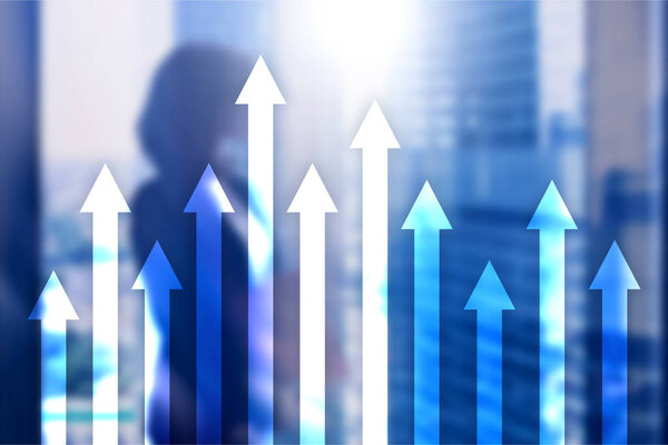 Up arrow graph on skyscraper background. Invesment and financial growth concept.