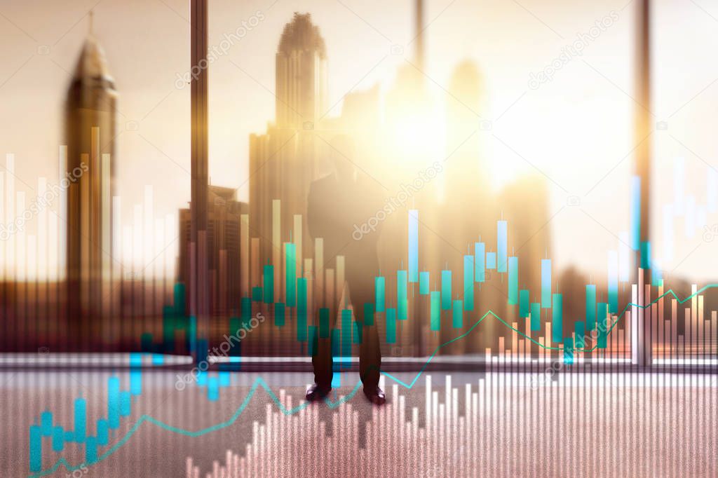 Stock trading candlestick chart and diagrams on blurred office center background.