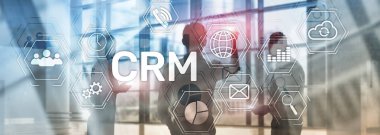 CRM, müşteri ilişkileri yönetimi sistemi kavramı bulanık arka plan üzerinde.