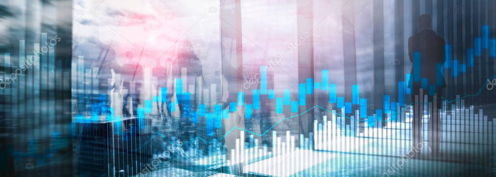 Stock trading candlestick chart and diagrams on blurred office center background.