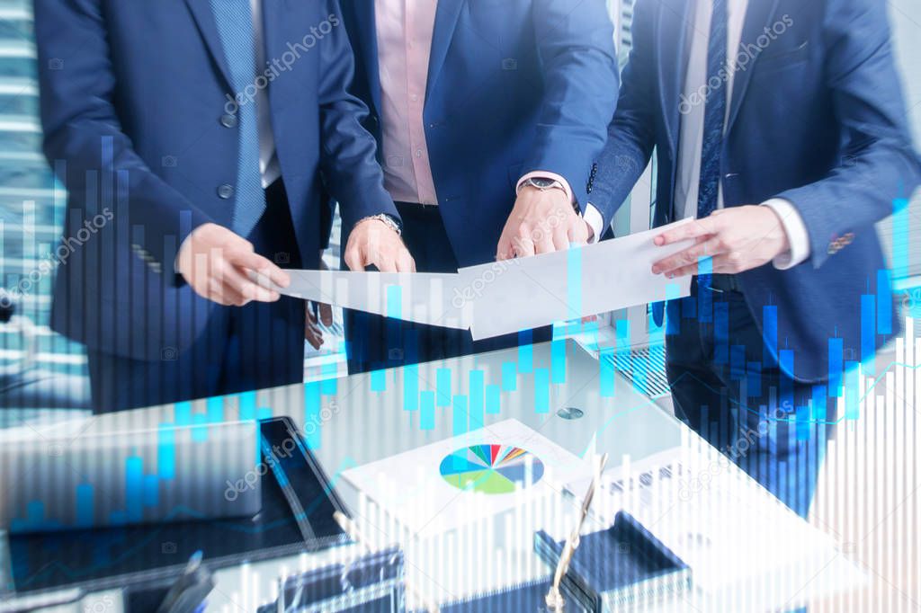 Stock trading candlestick chart and diagrams on blurred office center background.