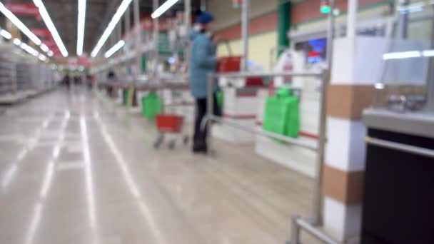 Girl Goes Cashier Blurred Background Supermarket — Stock Video