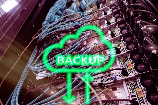 Backup button on modern server room background. Data loss prevention. System recovery.