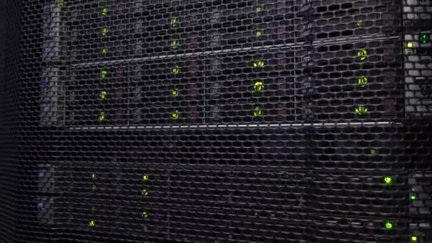 Motion shot. A large server room inside a cloud computing data center. Server stack with hard drives. SATA. — Stock Video